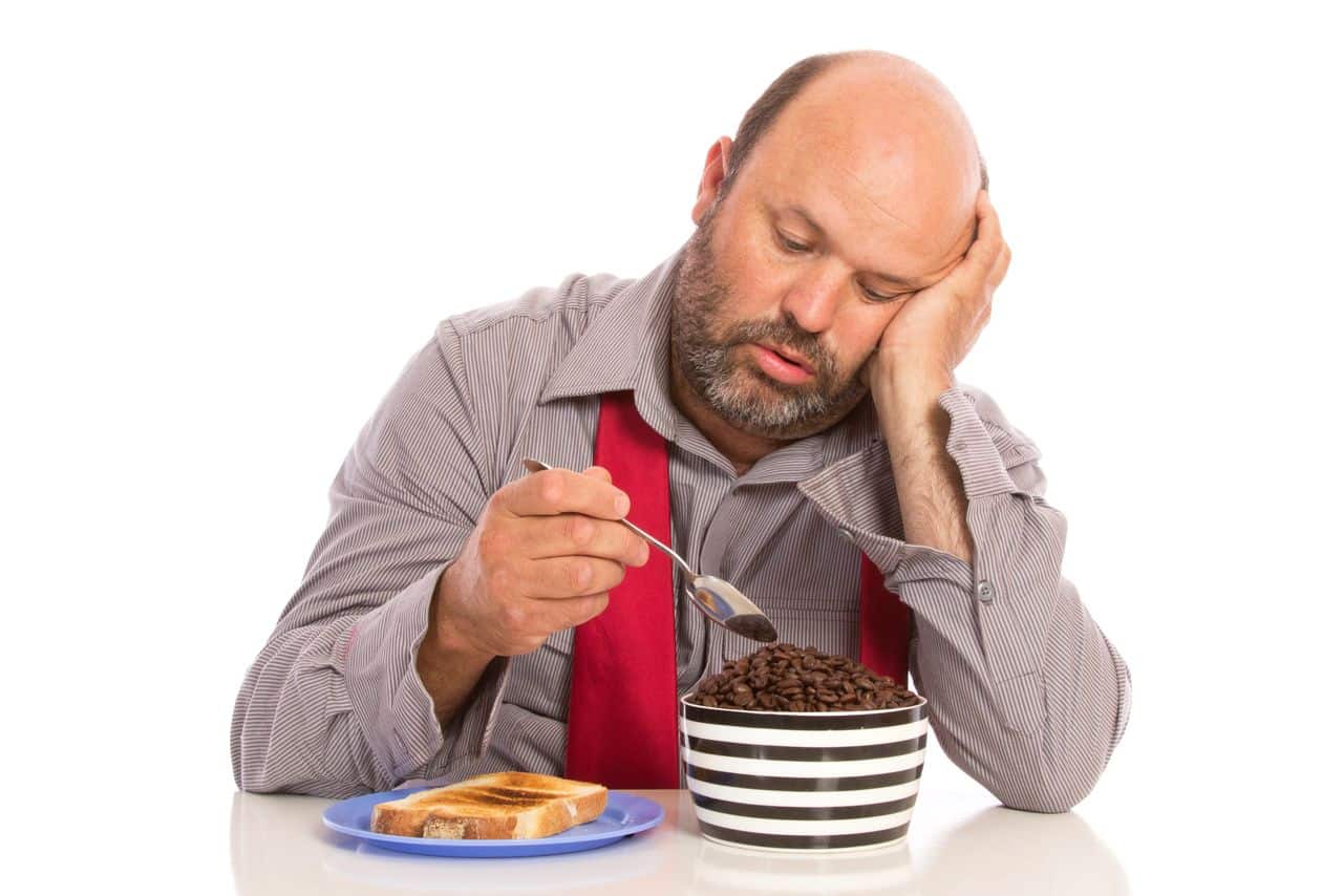 Roasted coffee beans and chocolate-covered espresso beans for snacking