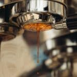 Hot water being poured for brewing coffee at the ideal temperature of 195 to 205 degrees Fahrenheit